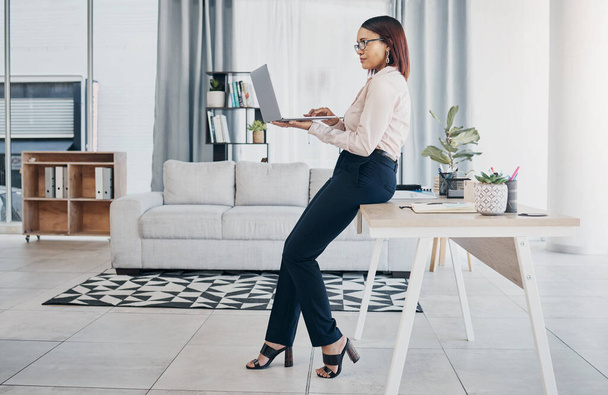Woman in modern office with glasses, laptop and reading email, HR schedule and online report feedback. Website, networking or communication on digital app, businesswoman at human resources agency. - Photo, Image