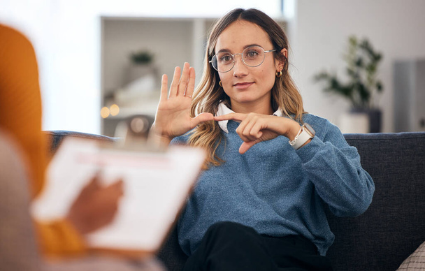 Sign language, speech therapy and woman talking to therapist in a consultation or counseling conversation. Communication, support and professional psychologist help person learning and speaking. - Photo, Image