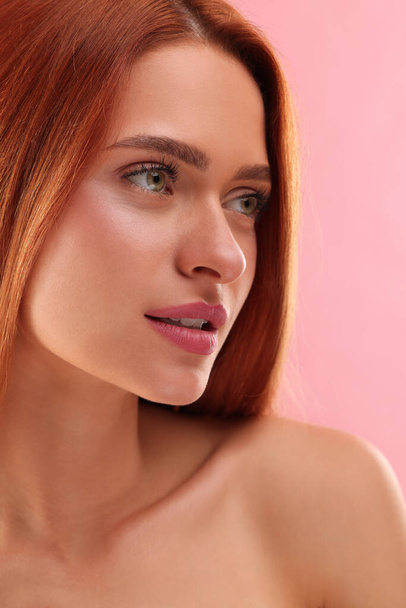 Portrait of beautiful young woman on pink background, closeup - Fotografie, Obrázek