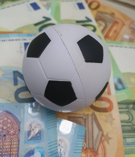 Euro coins and banknotes money currency of European Union and football ball useful as sport and money concept - Foto, Imagem
