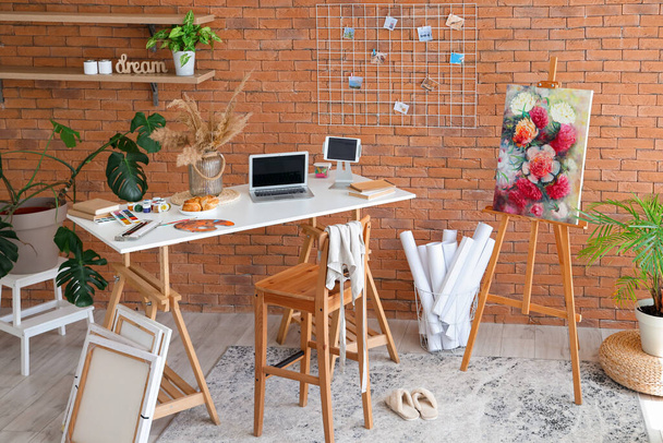 Interior of studio with artist's workplace and drawing supplies - Photo, Image