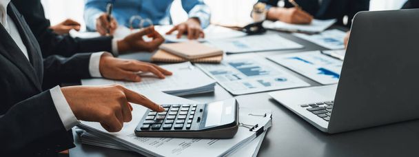 Auditor and accountant team working in office, analyze financial data and accounting record with calculator. Accounting company provide finance and taxation planning for profitable cash flow. Insight - Photo, Image