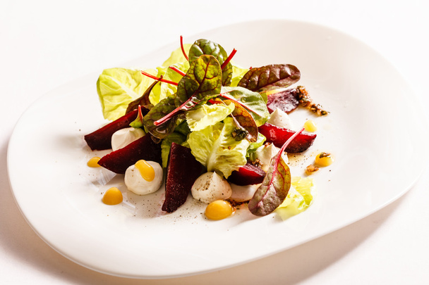Vegetarian salad with eggs on plate - Фото, зображення