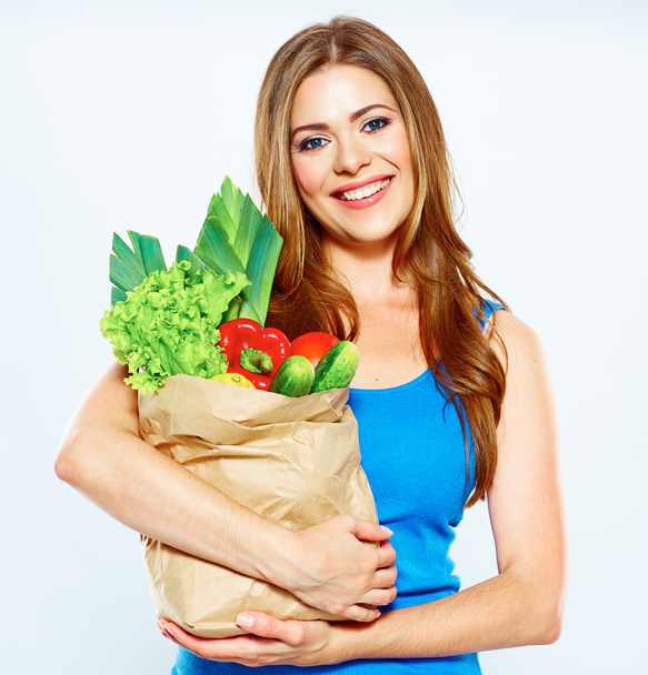 Woman holds vegetables - Φωτογραφία, εικόνα