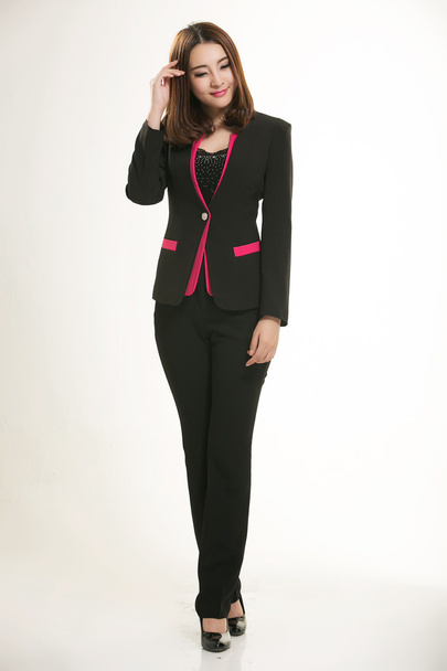 Young Asian women wearing a suit in front of a white background - Photo, Image