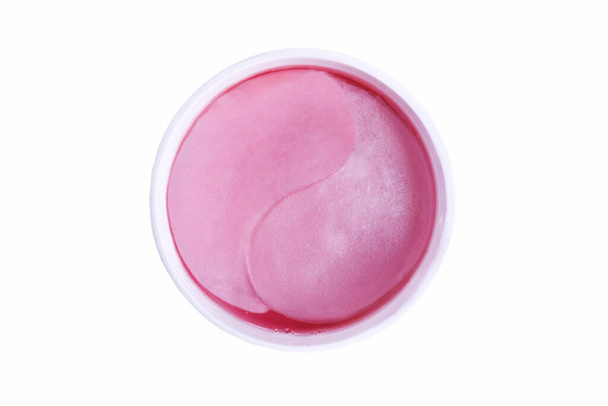 Pink hydrogel patches under the eyes isolated on white background. - Photo, Image
