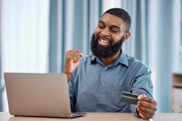 Man, winner and credit card on laptop for success, winning, e commerce payment or investment. African trader on computer and yes for business banking, finance goals or profit, sales and trading. - Photo, Image