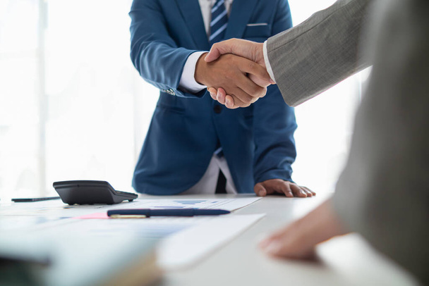 Businessmen and investors shake hands after attending  meeting with advisory team after receiving advice from  advisory team about jointly invested business. Businessmen Team handshake concept - Photo, Image