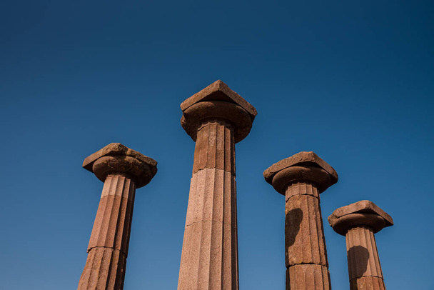 Ancient columns of Athena Temple, Assos, Canakkale, Turkey , The Temple of Athena in the archaeological site of ancient Assos in Behramkale, Turkey. High quality photo - Photo, Image