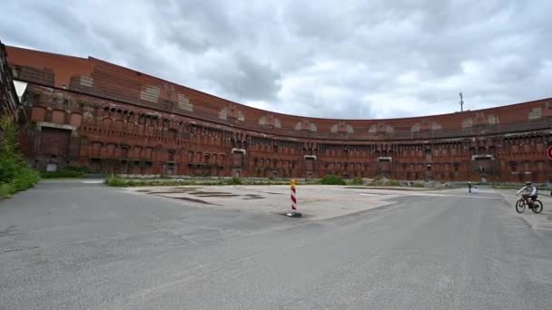 Nuremberg, Germany, August 1, 2023. At the Nazi military rally area slow motion pan footage from inside the convention center. Construction remained incomplete. Visitors read the information panels. - Footage, Video
