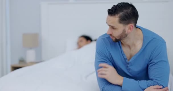 Divorce, stress and man on a bed with depression, anxiety or snoring problem in a house with insomnia. Marriage, conflict and couple in a bedroom fighting, ignore or frustrated by infertility crisis. - Footage, Video