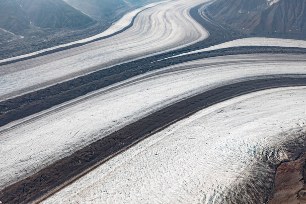 Confluence of the two major arms of Kaskawulsh Glacier with its glacial moraine stripes in St. Elias mountains of Kluane National Park, Yukon Territory, Canada - Photo, Image
