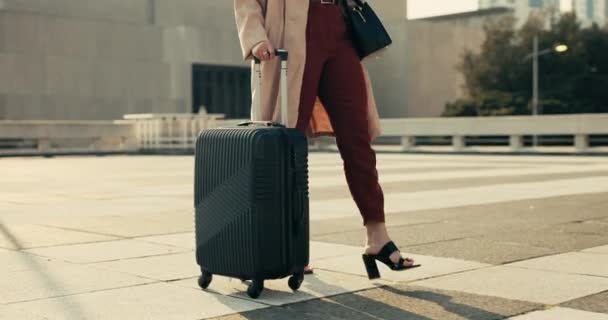 Feet, woman and walking with luggage for business outdoor on ground of rooftop, building or city for trip. Professional, person and legs with suitcase and steps to commute for career journey or work. - Footage, Video