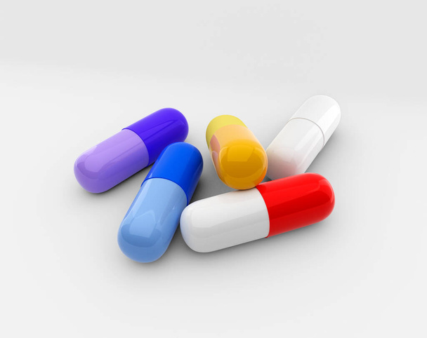 купа барвистих таблеток, таблеток і капсул на білому тлі - Фото, зображення
