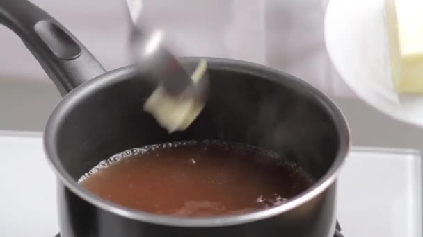 Gravy being thickened with butter - Filmati, video