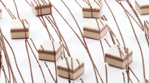 Rotating sweets with chocolate drizzle - Footage, Video