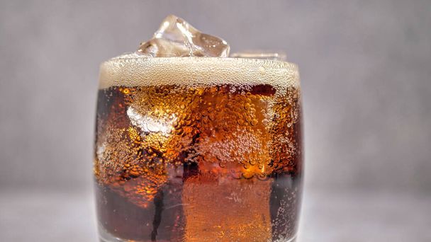 soda in a glass with ice. close-up - Photo, Image