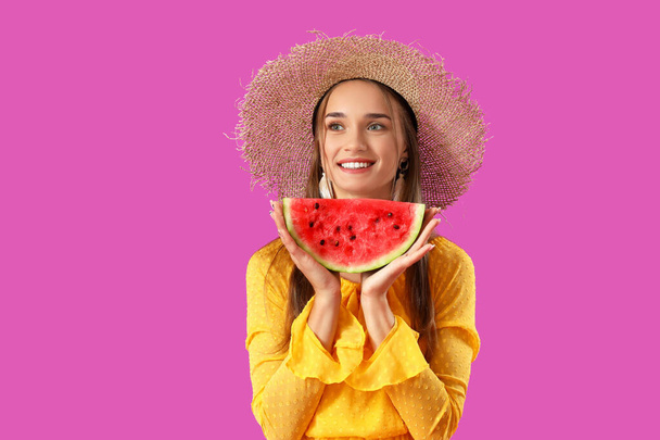 Young woman with fresh watermelon on purple background - Fotografie, Obrázek