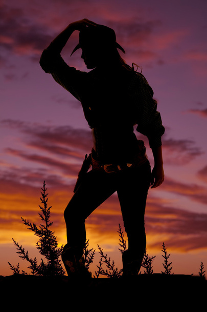 Silhouet van cowgirl buitenshuis - Foto, afbeelding