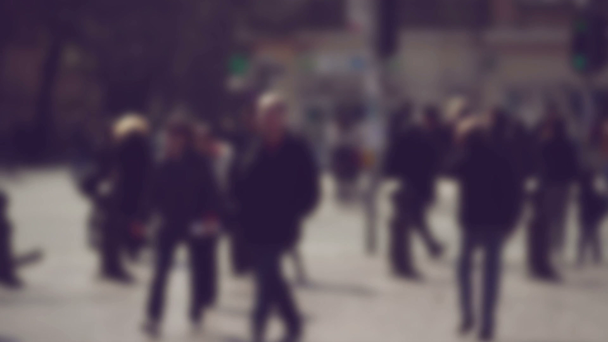 Blur Crowd of People Walking On the Street in Bokeh, unrecognizable group of men and women as blur urban background - Footage, Video