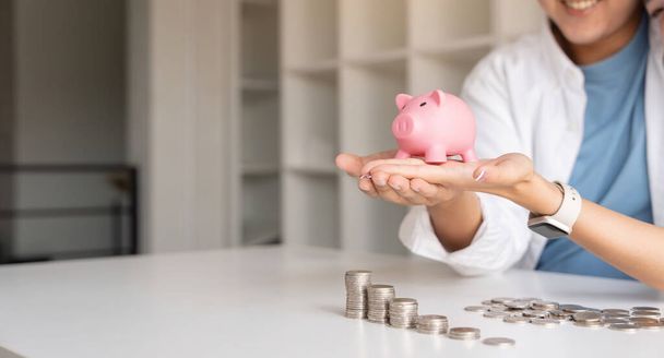 Saving money investment for future. Couple hands holding piggy bank with money . Couple asian counting saving money plan future budget. Investment banking concept. - Photo, Image