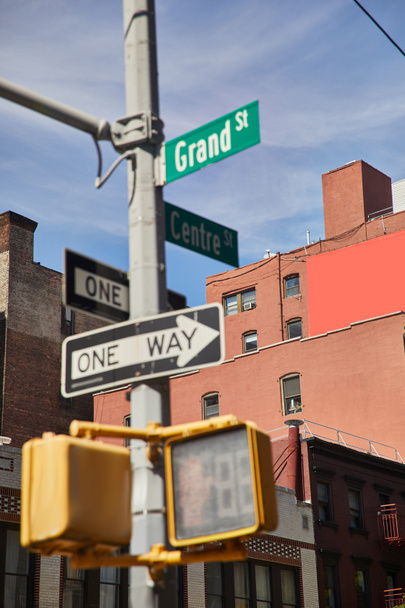 buildings and traffic signs showing directions on crossroad in new york city, urban signage - Foto, Imagem