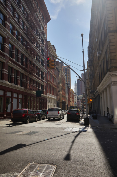 heavy traffic in rush hour on roadway of downtown district in new york city, fall streetscape - Fotó, kép
