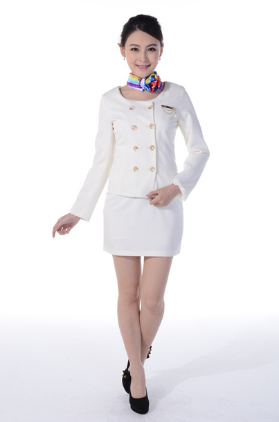 Aktív lány viselni szakmai öltözék egy fehér háttér előtt - Fotó, kép