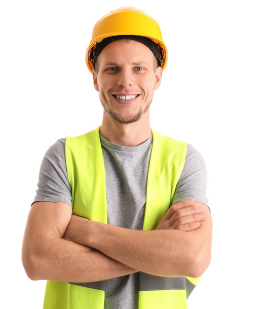 Muž pracovník v vestě a hardhat na bílém pozadí - Fotografie, Obrázek