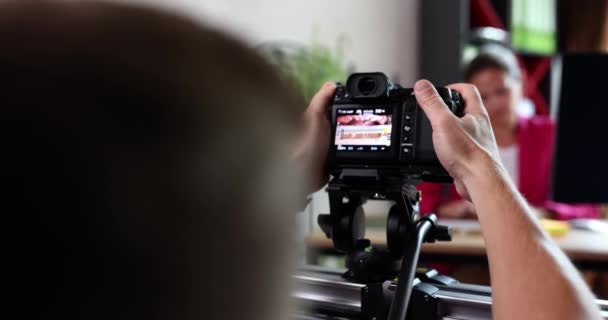 Cameraman filming on professional camera businesswoman in office 4k movie slow motion. Blogging concept - Metraje, vídeo