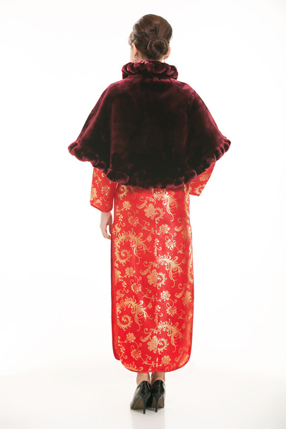 Kínai ruhapincér viselése fehér háttér előtt - Fotó, kép