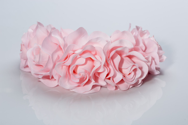 tiara of artificial  roses on a light background - Foto, imagen