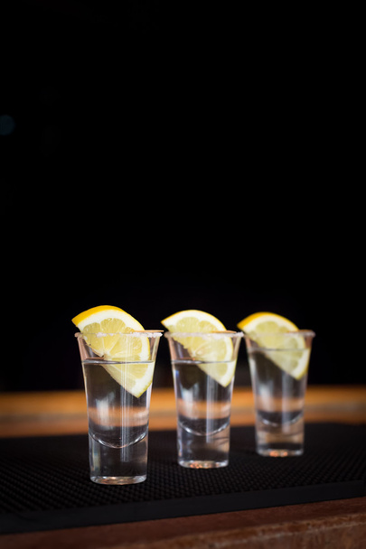 Three tequila shots with lemon - Photo, Image