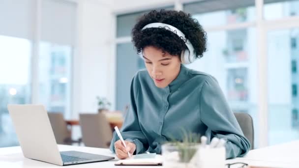 Business, headphones and woman with a laptop, writing and planning with brainstorming, ideas and connection. Person, girl and employee with a pc, notebook and inspire with copywriting and creativity. - Footage, Video