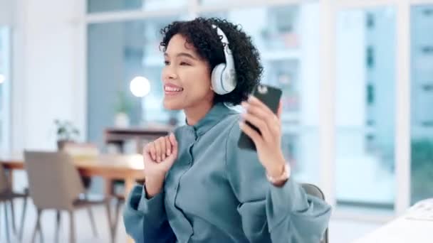 Business, headphones and woman with a cellphone, dance and promotion with achievement, motion or streaming music. Person, consultant or employee with energy, headset or smartphone with audio or sound. - Footage, Video