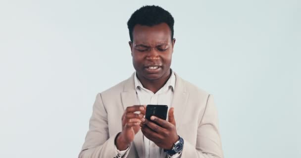 Businessman, phone and laugh in studio with smile for social media, communication or network in happiness. Black man, scroll and talking online for work information, internet chat or email connection. - Footage, Video