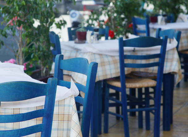 Blue chairs on a greek cafe on Zakinthos - Fotoğraf, Görsel