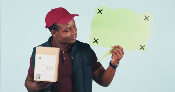 Delivery man, boxes and speech bubble in studio with face, smile and mockup for supply chain by blue background. African courier, package and tracking markers for feedback, logistics or shipping job. - Footage, Video