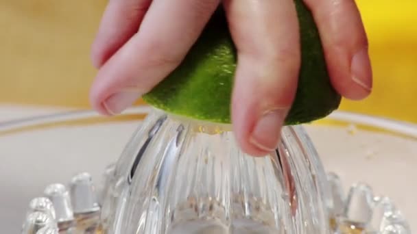 Squeezing a lime with squeezer - Footage, Video