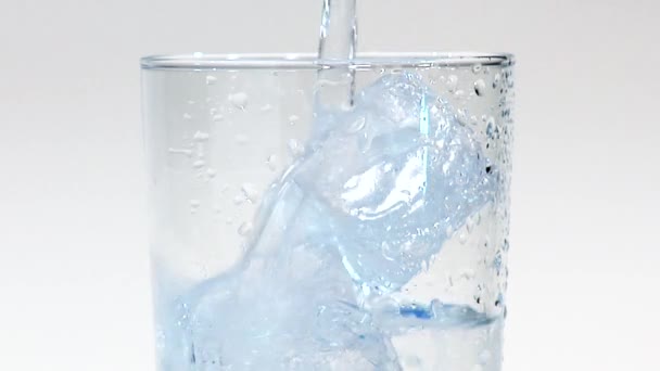Pouring water into a glass - Footage, Video
