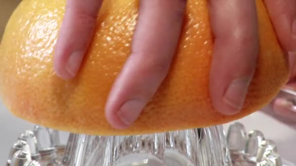 Squeezing a pink grapefruit - Footage, Video