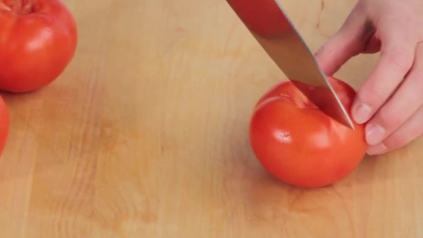 Chef chopping tomato roughly - Filmati, video