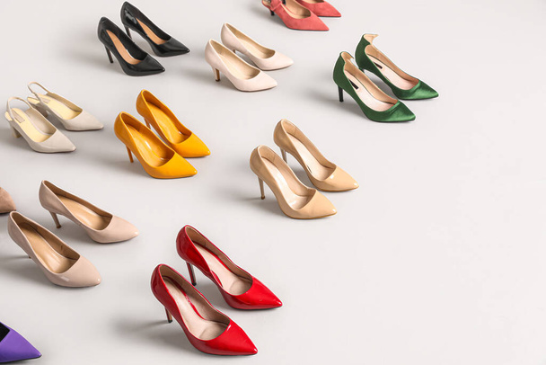 Many different stylish high heels on grey background - Photo, Image
