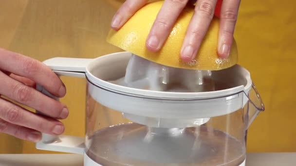 Squeezing a pink grapefruit - Footage, Video