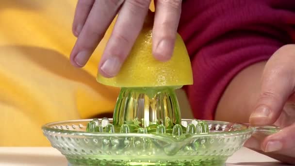 Squeezing a lemon on juicer - Footage, Video