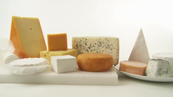 Cheeses on white background - Footage, Video