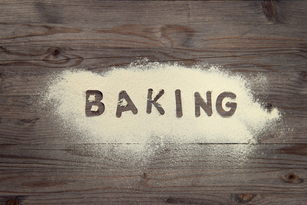 Word baking written in white flour - Φωτογραφία, εικόνα