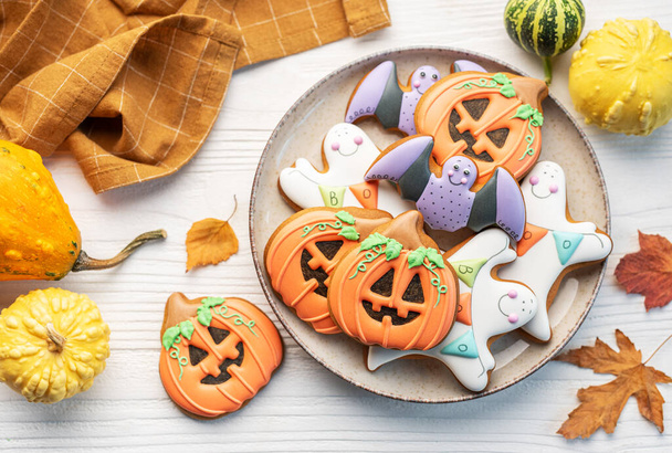 Multicolored Halloween homemade cookies on white wooden  background. - Photo, Image