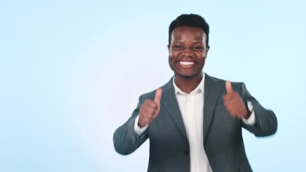 Face, happy and a black man with a thumbs up on a studio background for corporate success. Excited, thank you and portrait of an African employee with an emoji gesture on mockup space for a like. - Footage, Video