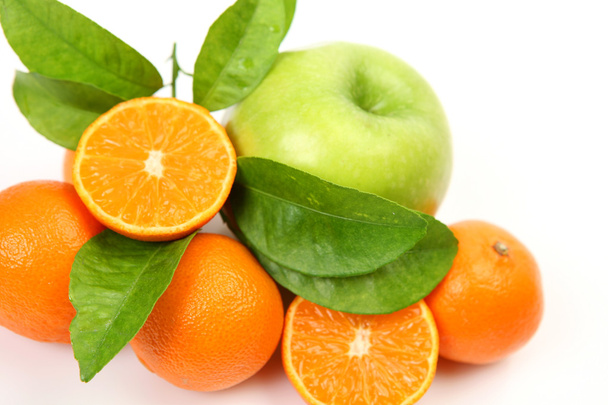 Ripe tangerines with apple and  leaves - 写真・画像
